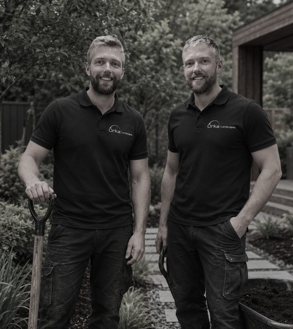 Tom and Will of Orka Landscapes standing in a garden